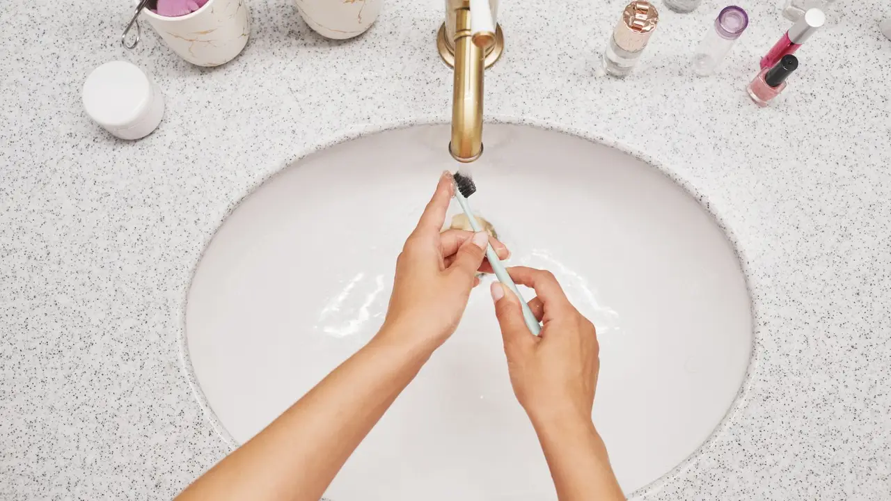 White limescale deposits on a kitchen faucet caused by hard water